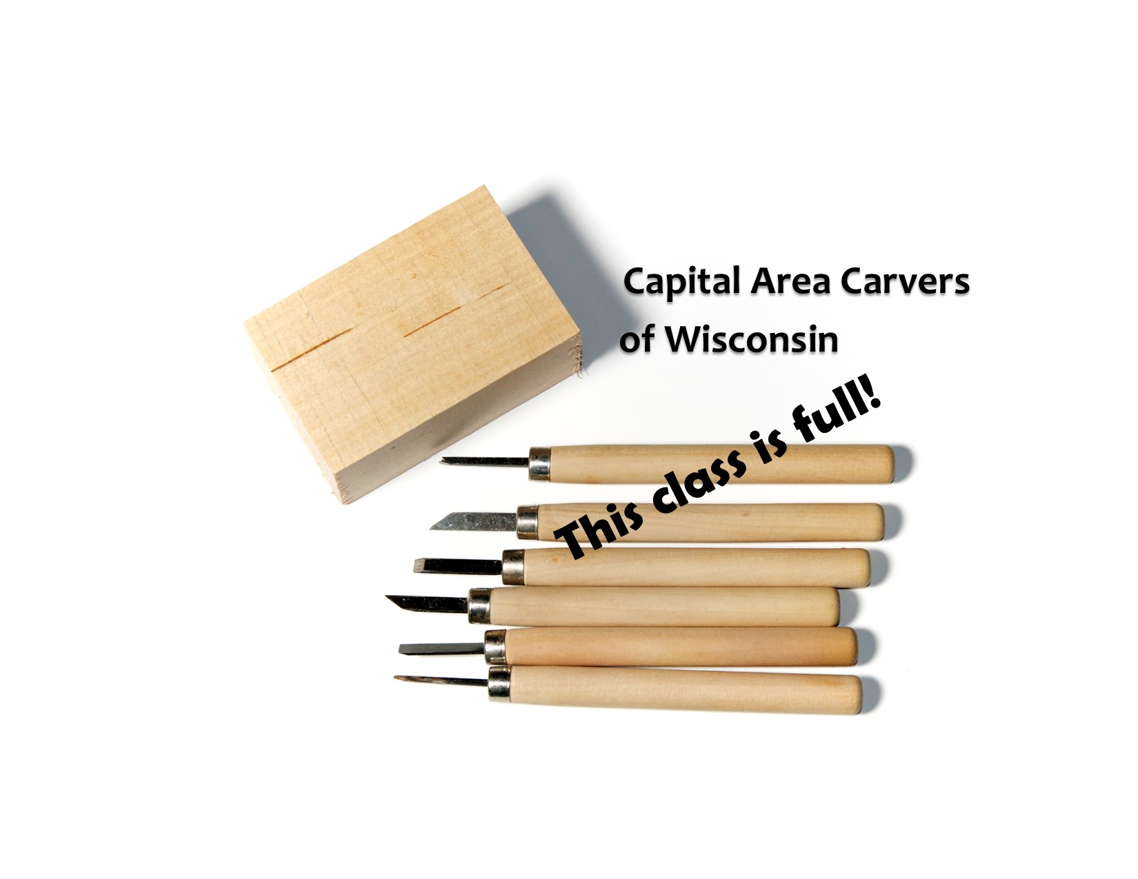 The name Capital Area Carvers of Wisconsin with a set of woodcarving tools