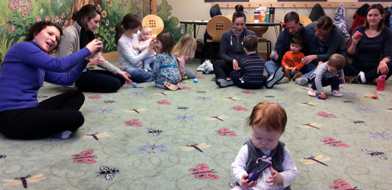 Music Together teacher Catherine Olson sings with children and their grown-ups.