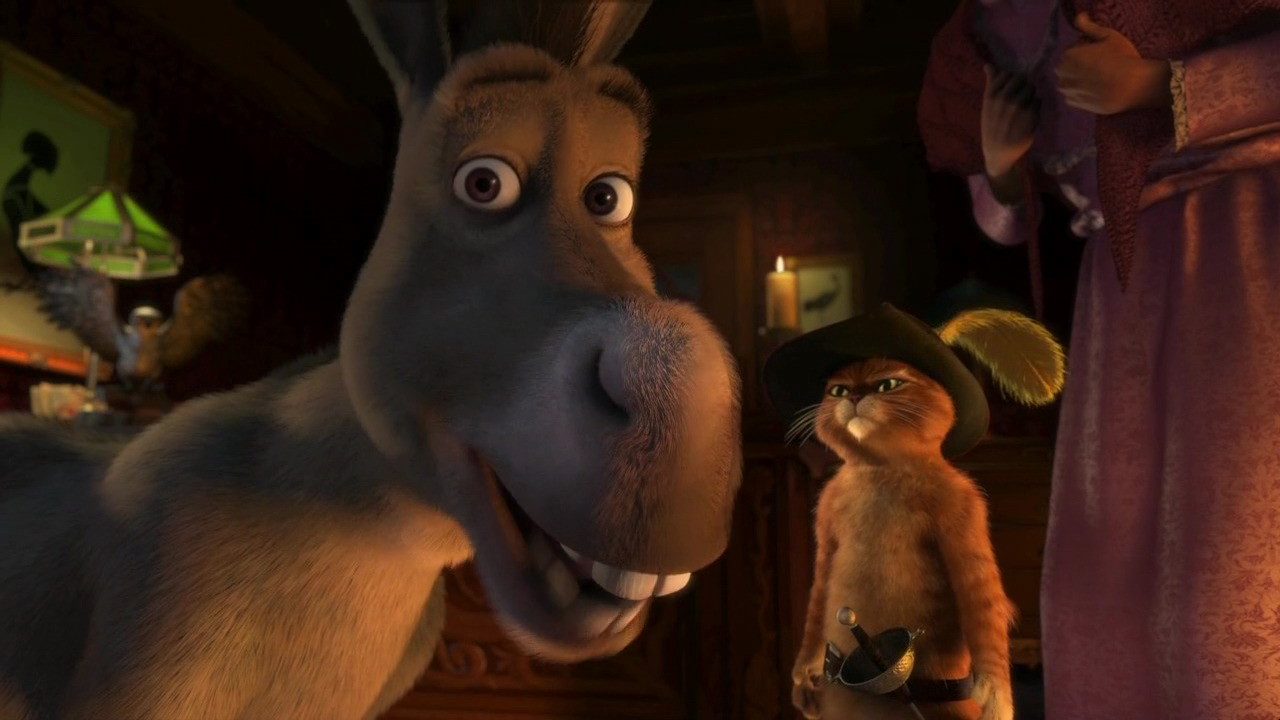 Scene capture from Scared Shrekless with Donkey in the foreground and Puss in Boots behind him.