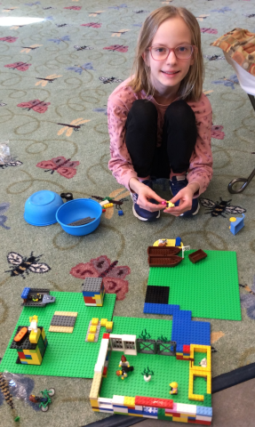Girl building with legos