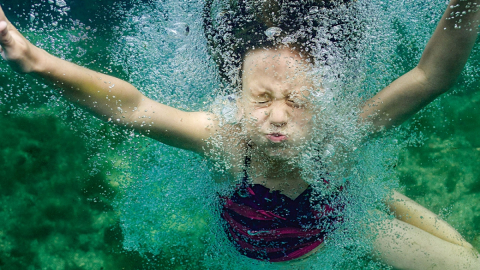 Child swimming underwater