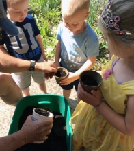 children planting beans at storytime
